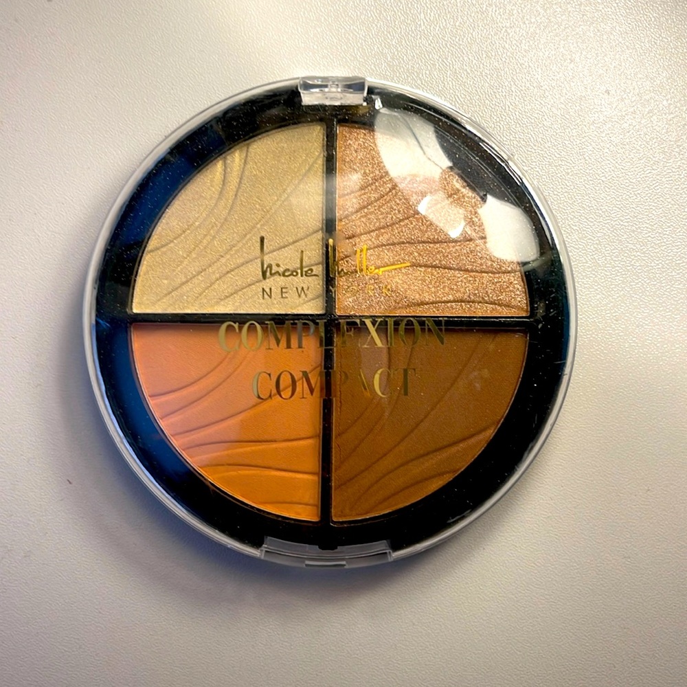 Nicole miller complexion compact.